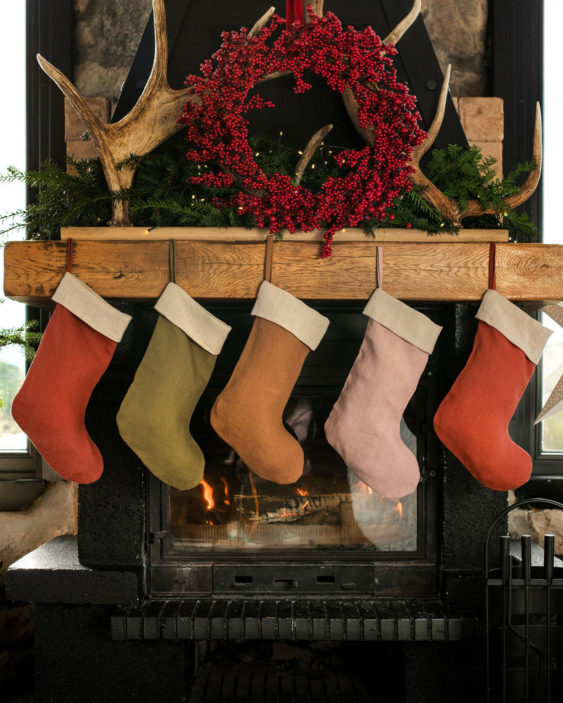 MagicLinen's handcrafted linen Christmas stocking features a soft, double-layer design with a hanging loop, perfect for adding sustainable charm to your holiday decor.