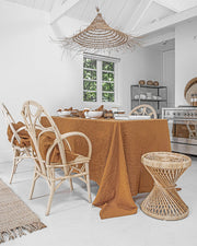 MagicLinen forest green linen tablecloth, 59 x 98 inches, with a simple seam finish, ideal for enhancing dining settings at Athens Cooks' curated kitchen store.