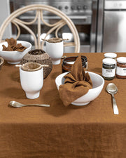 MagicLinen forest green linen tablecloth, 59 x 98 inches, with simple seam finish, ideal for enhancing dining settings at Athens Cooks.