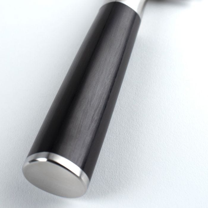 Close-up of the Shun Classic Kiritsuke 8-inch knife's polished metal handle end, showcasing its craftsmanship and versatility, ideal for diverse culinary tasks.