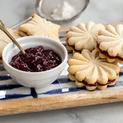Nordic Ware | Pretty Pleated Cookie Stamps: A plate of jam-topped cookies made with intricate imprints using the USA-crafted cookie stamps from Athens Cooks.