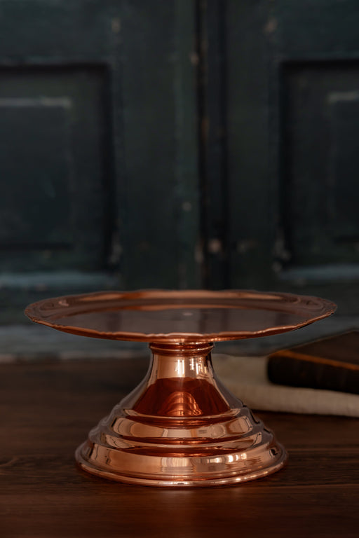 Coppermill Kitchen LLC | Vintage Inspired Cake Stand: Polished copper with scalloped edge and tiered base, perfect for displaying desserts or decor in an old-world kitchen style.