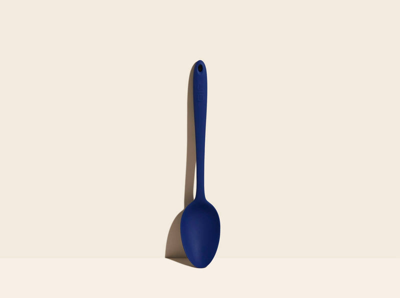 GIR | Ultimate Spoon, a versatile kitchen tool for mixing and serving, featuring a deep bowl and flexible edges, ideal for high-heat cooking.