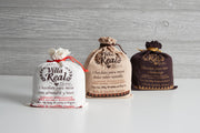 Three Villa Real draw-string pouches: almond & walnut, vanilla, and semi-bitter flavors, each containing 500g of Oaxacan artisanal table chocolate tablets.