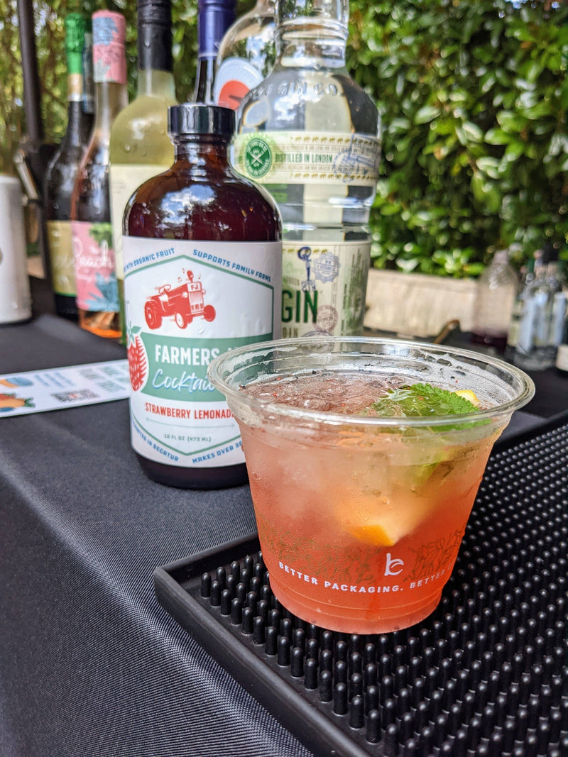 Farmers Jam | Strawberry Lemonade Cocktail Syrup - 8oz, featured with a mint-garnished cocktail, ideal for crafting refreshing summer drinks without extra ingredients.