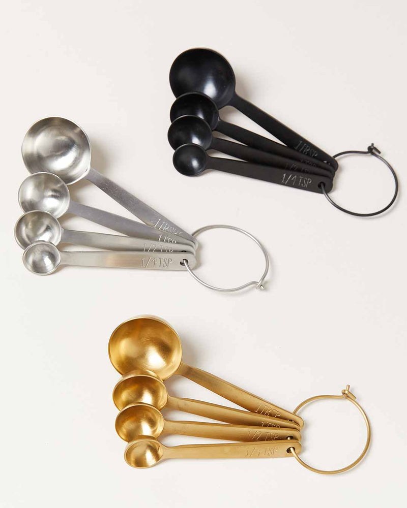 Farmhouse Pottery - Stowe Measuring Spoons: Brushed Gold set displayed on a light background, showcasing four precise, durable spoon sizes for baking.