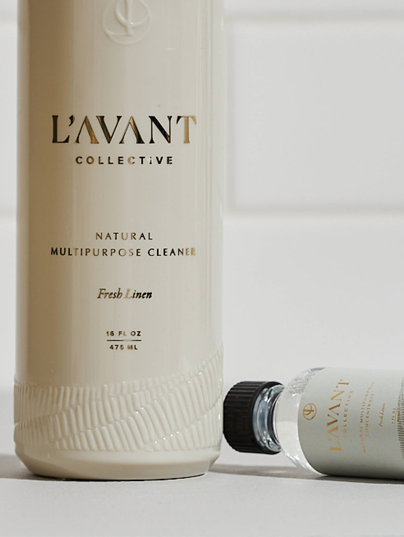 L'AVANT Collective - Fresh Linen Multipurpose Cleaner Refill in a sleek white glass bottle, ideal for eco-friendly cleaning solutions, enhancing sustainability in your kitchen routine.