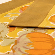 Caravan Home - Pumpkin Orange/Mustard Runners: 16 x 90, featuring handprinted, autumn-themed linens with abstract floral patterns, perfect for enhancing fall table settings at Athens Cooks.