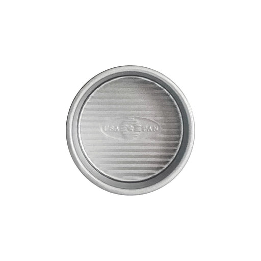 USA Pan | Cake Pans - 4 in Round, silver metal with embossed logo, features FDA-approved nonstick coating and ridged texture for even baking. Ideal for all bakers.