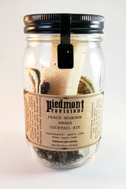 Piedmont Provisions | Cocktail Infusion Kits - Bourbon Peach Smash displayed with its mason jar for crafting flavorful cocktails. Ideal for enhancing your home bar experience.