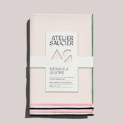 ATELIER SAUCIER - Macaw Burlap Napkins, Set of 4 displayed with a white label in a kitchen setting, ideal for vibrant, everyday dining experiences.