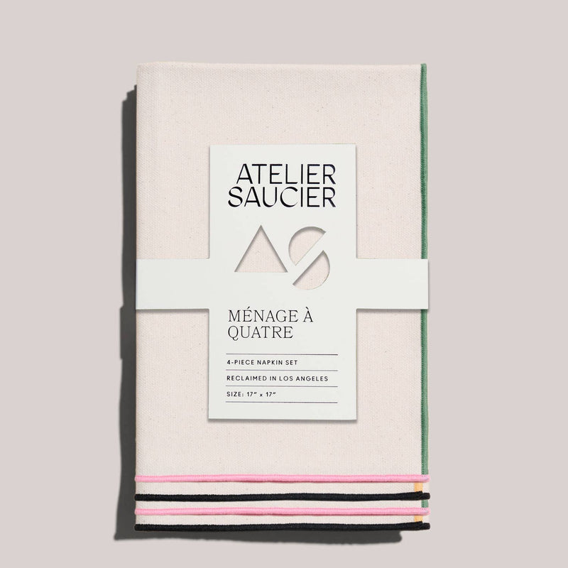 ATELIER SAUCIER - Macaw Burlap Napkins, Set of 4 displayed with a white label in a kitchen setting, ideal for vibrant, everyday dining experiences.