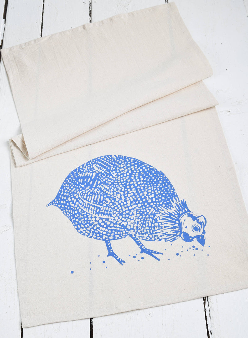 Hearth and Harrow - Organic Cotton Guinea Hen Tea Towel in Blue-violet, featuring a detailed bird design, hand-printed on premium cotton for kitchen use.