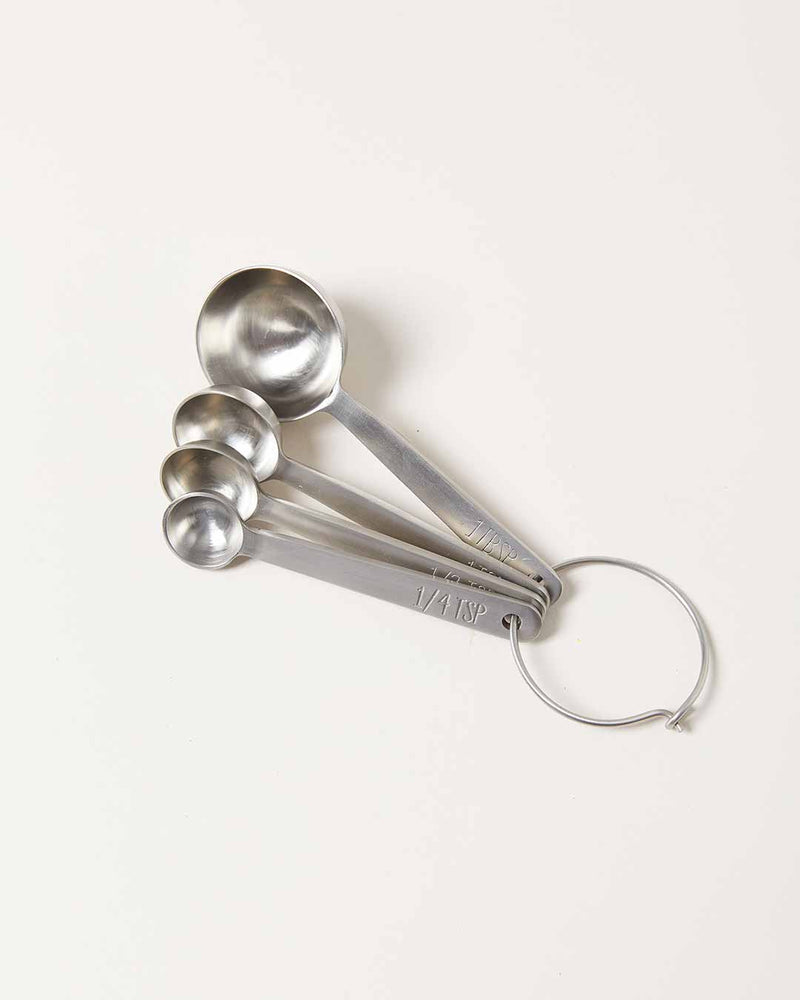 Farmhouse Pottery - Stowe Measuring Spoons: Brushed Gold / Single, a set of four nested stainless-steel spoons on a ring, showcasing luxury and precision for baking.