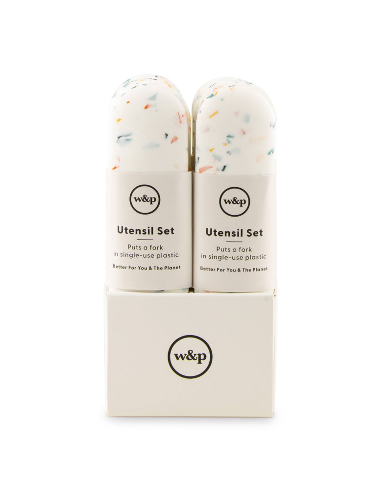 W&P - Stainless Steel Utensils Set in Silicone Carry Case: Terrazzo Charcoal, featuring compact stainless steel fork, knife, and spoon in a white silicone case, ideal for travel.