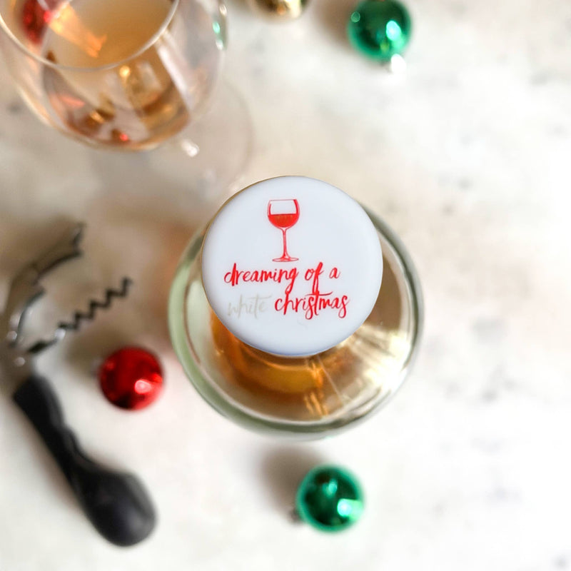 CapaBunga | Holiday Wine Caps - Santa Paws, shown on a wine glass, ideal for festive entertaining, available at Athens Cooks, enhancing your holiday gatherings.
