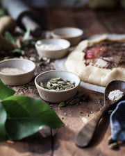 Farmhouse Pottery - Silo Ramekin: Single, a small ceramic bowl, holding green cardamom pods on a rustic wooden table, perfect for versatile kitchen use.