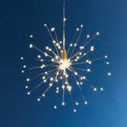 Napa Home & Garden - Napa Night Sky LED Starburst Lights Small, showcasing 120 warm white LEDs in a striking starburst design against a nighttime sky.