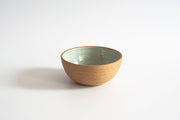 RachaelPots - Breakfast Bowl: Sage, a hand-thrown, versatile ceramic bowl with a mint-green interior and sandy-brown exterior, suitable for breakfast or dessert.
