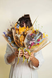 Idlewild Floral Co. - Christmas Mini Market Bouquet features two hand-tied dried flower bouquets, wrapped in craft paper, perfect for a timeless, maintenance-free decorative touch.