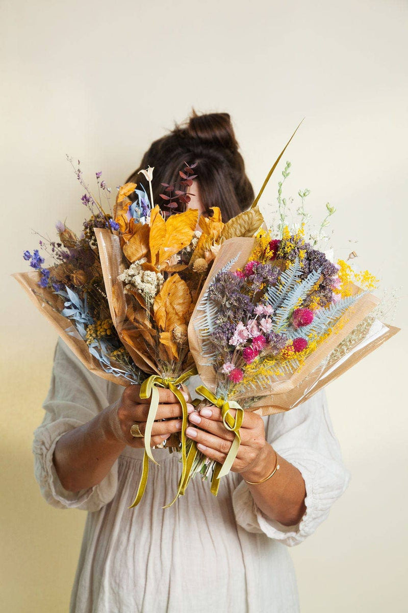 Idlewild Floral Co. - Christmas Mini Market Bouquet features two hand-tied dried flower bouquets, wrapped in craft paper, perfect for a timeless, maintenance-free decorative touch.