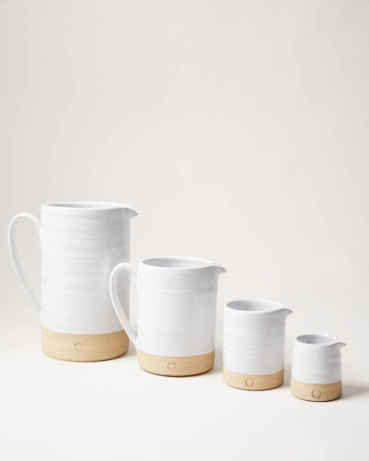 Farmhouse Pottery - Silo Pitchers: Petite, part of a four-sized ceramic pitcher set with white glaze and beige clay base, ideal for drinks or flowers.