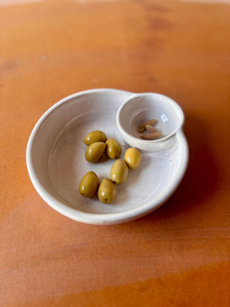 ROB Ceramics - Olive Serving Bowl Handmade: White, featuring a main dish with green olives and a side cup for pits, ideal for elegant entertaining.