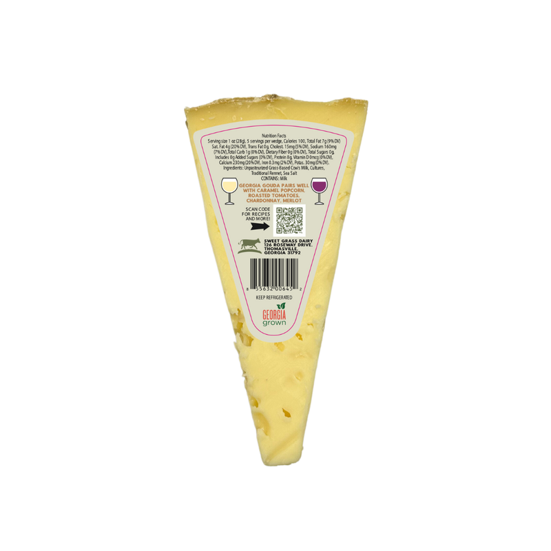 Sweet Grass Dairy - Georgia Gouda wedge in packaging, featuring nutrition facts, ingredients, pairing suggestions, and awards, emphasizing its rich, creamy texture and tangy-sweet flavor.