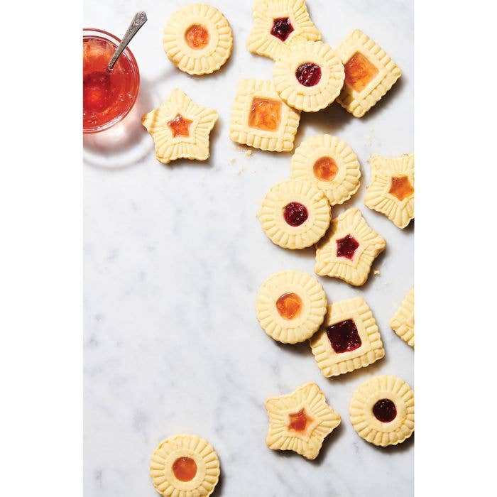 HIC - Harold Import Co. - King Arthur Thumbprint Cookie Cutters 4-Piece Set on display, featuring embossed cookies with jam-filled centers on a marble surface.