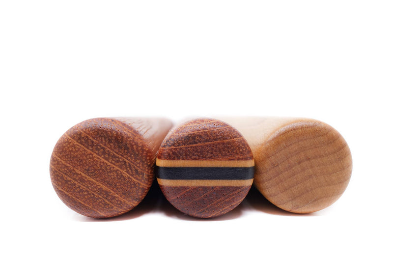 Close-up of the Earlywood | Dumpling Pin - Jatoba, a compact, handcrafted wooden rolling pin with smooth edges, ideal for precise dough rolling tasks.