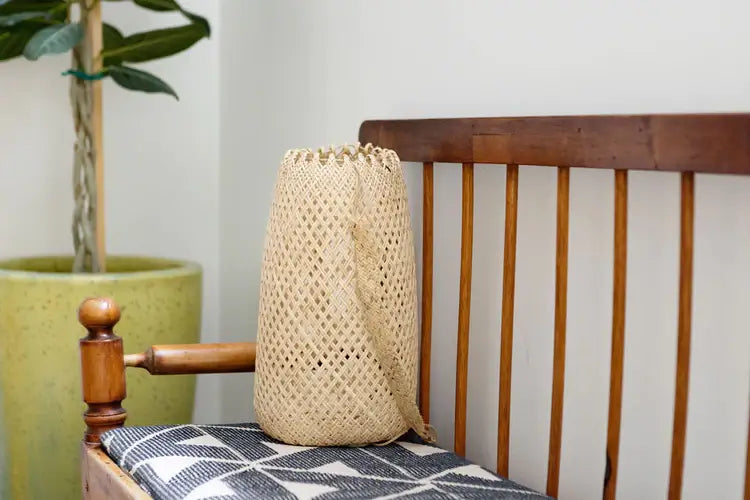 NEEPA HUT - Hanging Storage Basket, woven from bamboo/rattan with indigenous patterns, ideal for carrying items or decorative storage, aligning with Athens Cooks' curated lifestyle offerings.