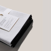 ATELIER SAUCIER - Cream Burlap Noir Napkins, set of 4, off-white with dark trim, reclaimed fabric, enhancing kitchen elegance.