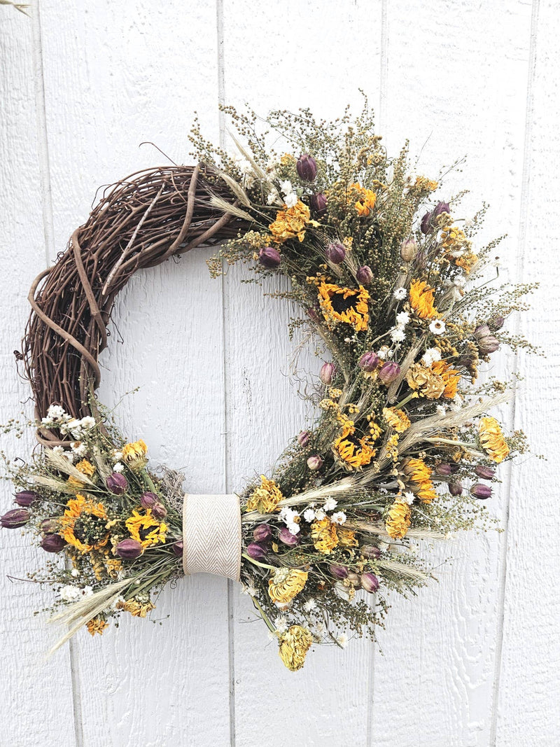 Alissas Flower Farm - Wreath: Sunflowers on Sweet Annie, featuring a grapevine base with dried flowers, including sunflowers and zinnias, elegantly arranged.