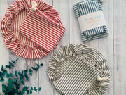Dot and Army | Bread Makers Set in Ticking Stripes - blue: Close-up of reusable bowl cover and cotton bread bag with red and white stripes, showcasing durable craftsmanship.