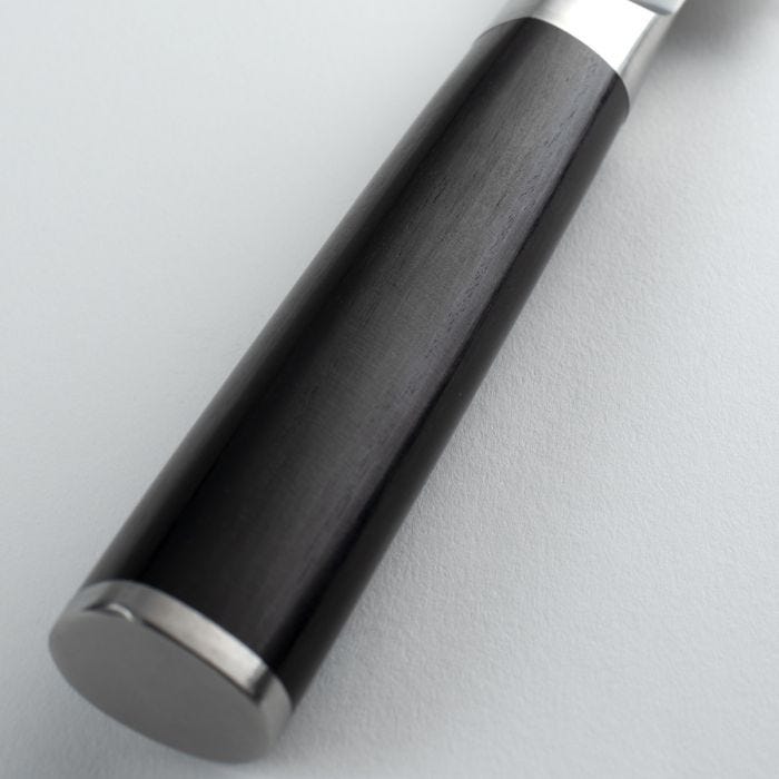 Close-up of the Shun Classic Bread Knife's black handle with a polished metal end-cap, highlighting its ergonomic design ideal for slicing bread effectively.