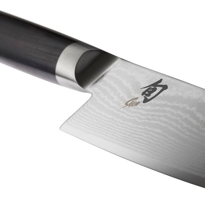 Shun | Classic Chef's Ebony, 8 inches knife showcasing its Damascus-pattern blade, Shun logo, and dark wood handle, ideal for versatile kitchen tasks.