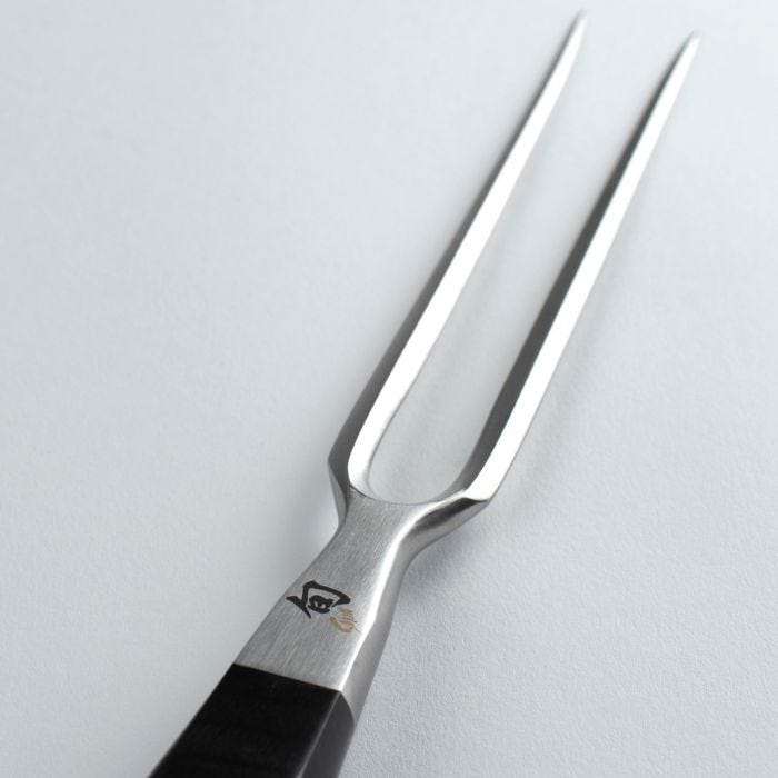 Shun Classic Carving Set, 2-Piece, featuring a stainless steel carving fork and a VG-MAX slicing knife, both with ebony-finished Pakkawood handles, in a gift box.