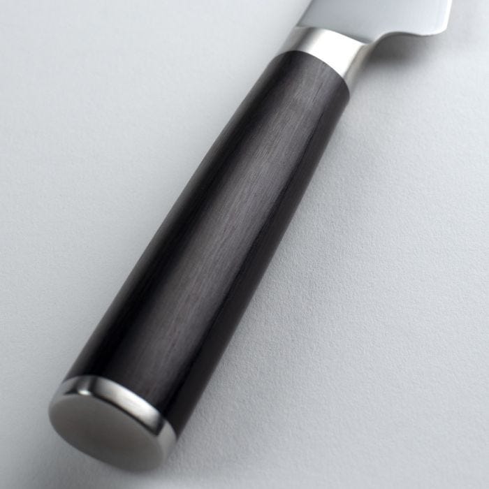 Close-up of Shun | Classic Boning & Fillet knife handle, featuring a dark cylindrical grip with polished metal end cap, embodying precision and craftsmanship for efficient meat preparation.