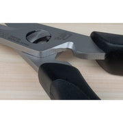 Shun Kitchen Herb Shears, 7.5 inches, with stainless-steel blades, black ergonomic handles, and built-in notch for versatility, on a light wood surface.