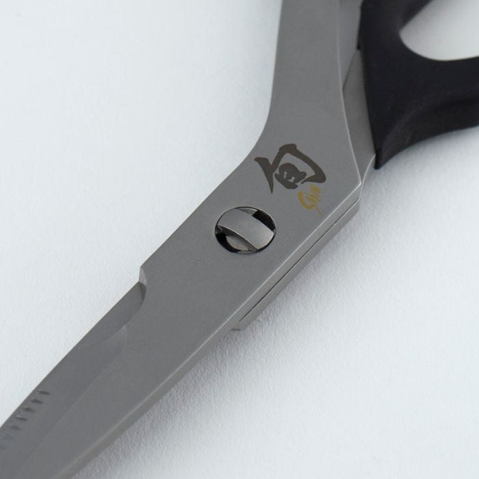 Shun | Kitchen Shears, 9 inches, featuring Japanese character etching, gold logo on blade, pivot joint, slotted screw, and black handle detail, designed for versatile kitchen use.