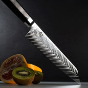 Close-up of Shun Dual Core Kiritsuke, 8 inches, showcasing its Damascus-style blade over fruit, highlighting intricate steel patterns ideal for precise kitchen tasks.