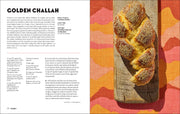 Cookbook spread from Penguin Random House LLC - Shabbat featuring a Golden Challah recipe with a photo of a braided, sesame-seed-topped challah loaf on a wooden board.