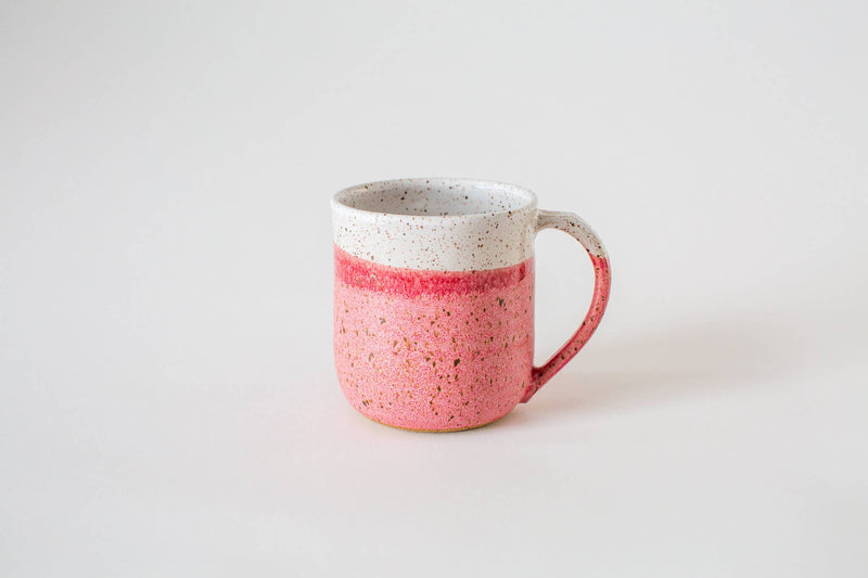 RachaelPots - 12 Oz Original Mug: Sage, hand-thrown ceramic with speckled rim, textured pink body, and thumb rest handle, ideal for coffee or tea.