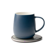 OHOM - Ui 3 Self-heating Mug Set: Jasmine White, features a dark-blue ceramic mug on a slim metal base with a purple LED, ideal for maintaining drink temperature.