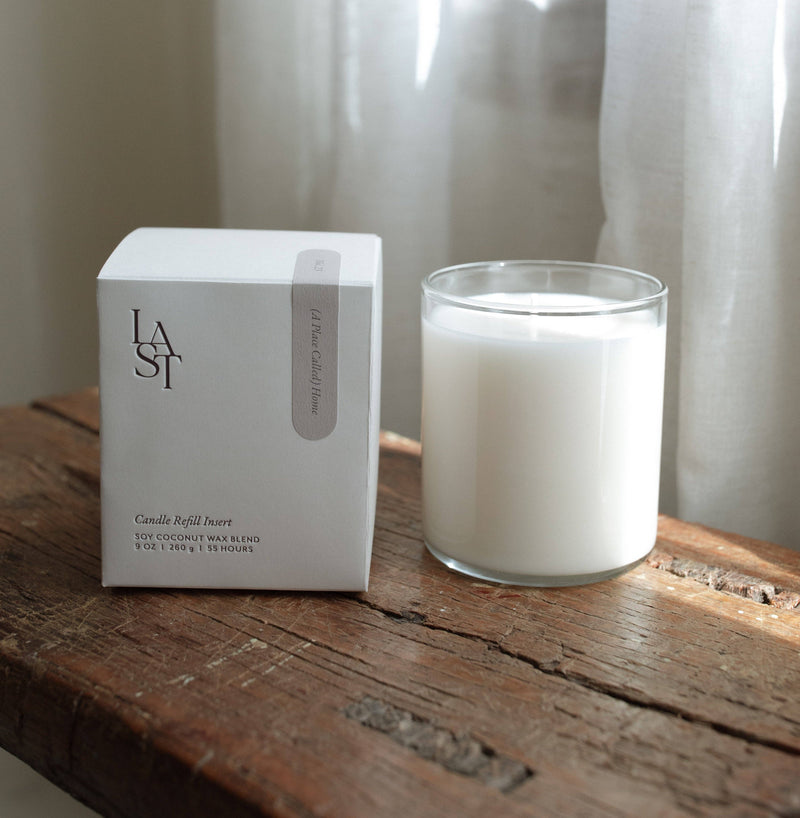 Last Candle Co. | No. 23 Home Candle Refill Insert, soy-coconut wax blend in a clear glass jar, set on a rustic wooden surface.