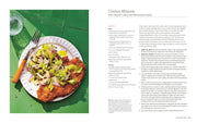 By Heart cookbook spread featuring Chicken Milanese recipe with panko-crusted chicken and salad, capturing home-cooked Italian American flavors by Hailee Catalano.
