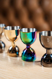 Bull in China | Bell Jiggers - Silver, close-up view, highlighting ergonomic design and internal markings for precise drink measurements, ideal for home or professional bar use.