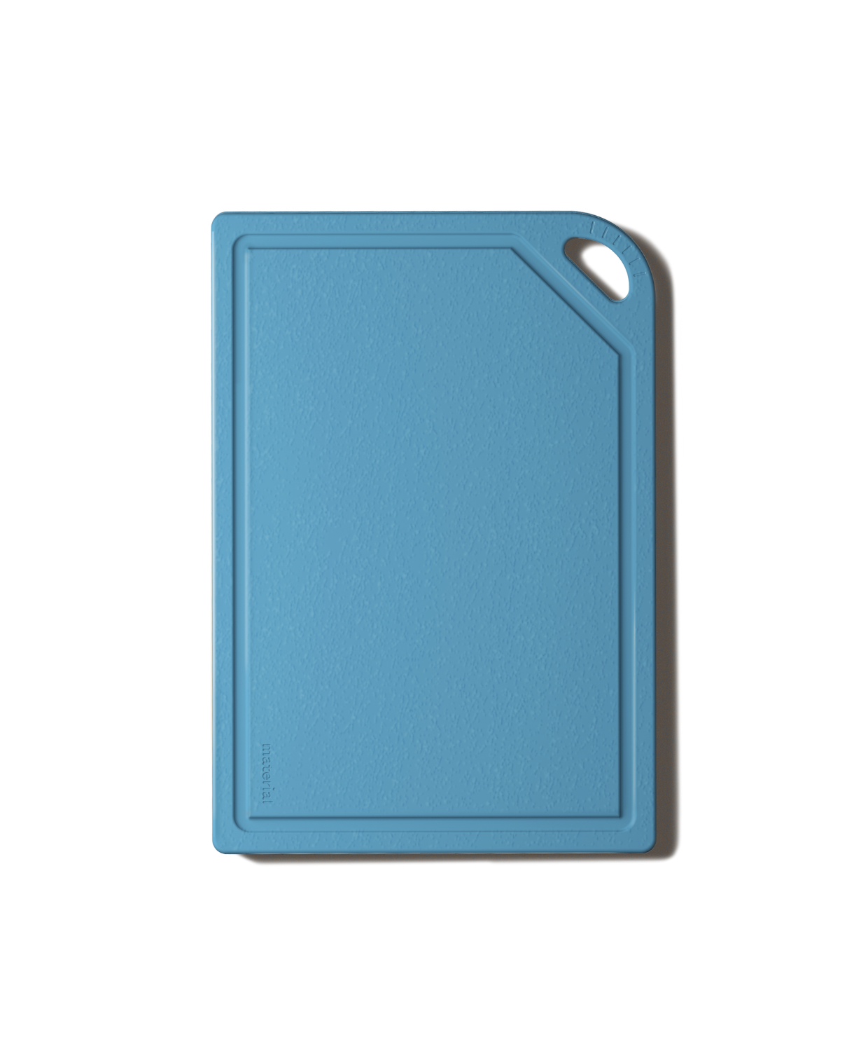 The MK Free Board: Ocean, a sky-blue kitchen cutting board with a textured surface, raised edges, and a corner handle for easy use and storage.