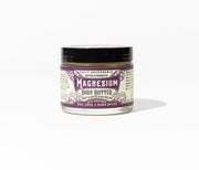 Roots And Leaves - Magnesium Body Butter jar, featuring a close-up of the label, designed for soothing skin application and rapid magnesium absorption.