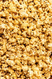 Poppy Hand-Crafted Popcorn - Mexican Street Corn Popcorn: A close-up of seasoned popcorn, highlighting its chipotle, cumin, and lime-infused texture, perfect for a flavorful snack adventure.